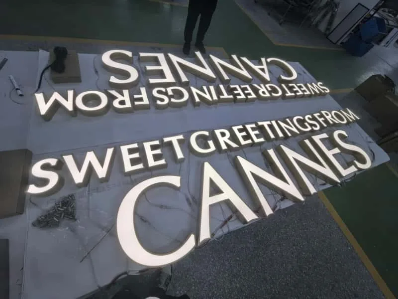 Fabricated LED letters being inspected during sign production