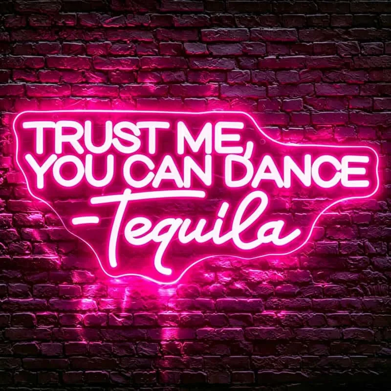 Pink neon-style LED wall sign in a dark interior