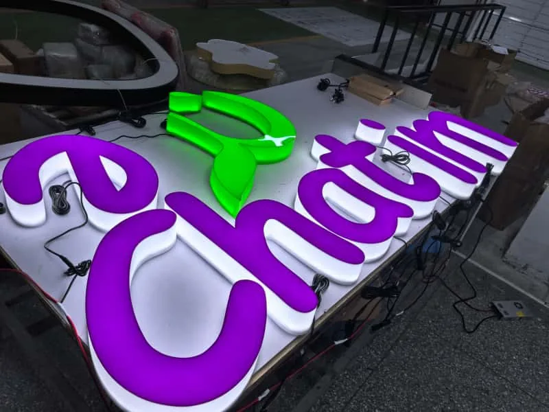 Colorful fabricated illuminated letters during workshop assembly