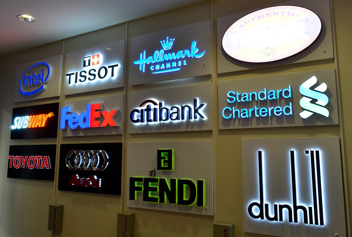 LED signage display featuring illuminated channel letters and brand signs