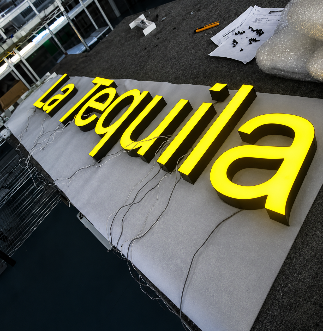 Illuminated acrylic sign letters wired and tested before installation