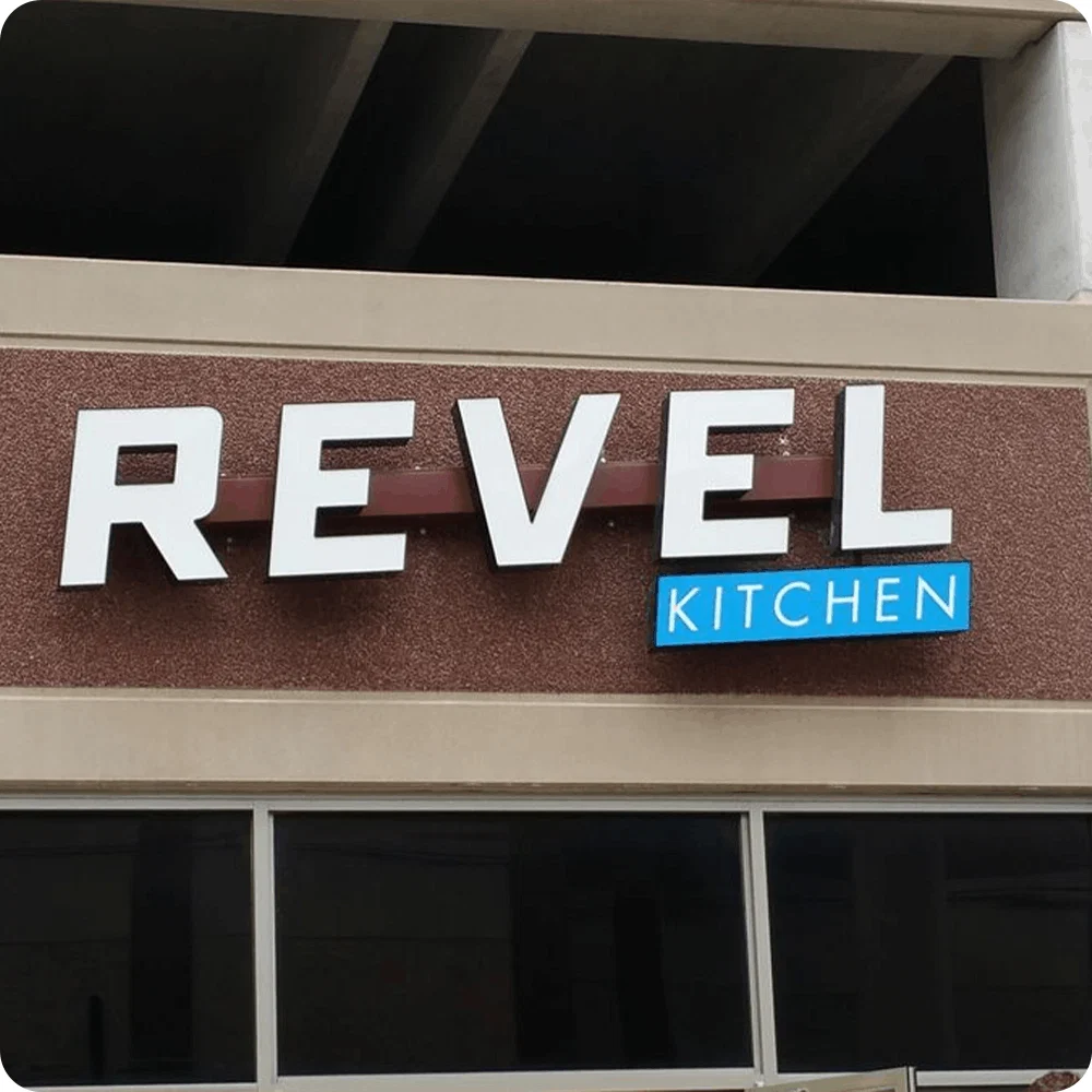 Commercial channel letters mounted on a full-size metal raceway