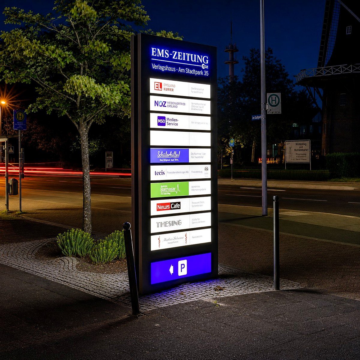 Illuminated vertical pylon sign with steel structural supports visible from the cabinet face down to the ground at night. Illuminated vertical pylon sign with steel structural supports visible from the cabinet face down to the ground at night.