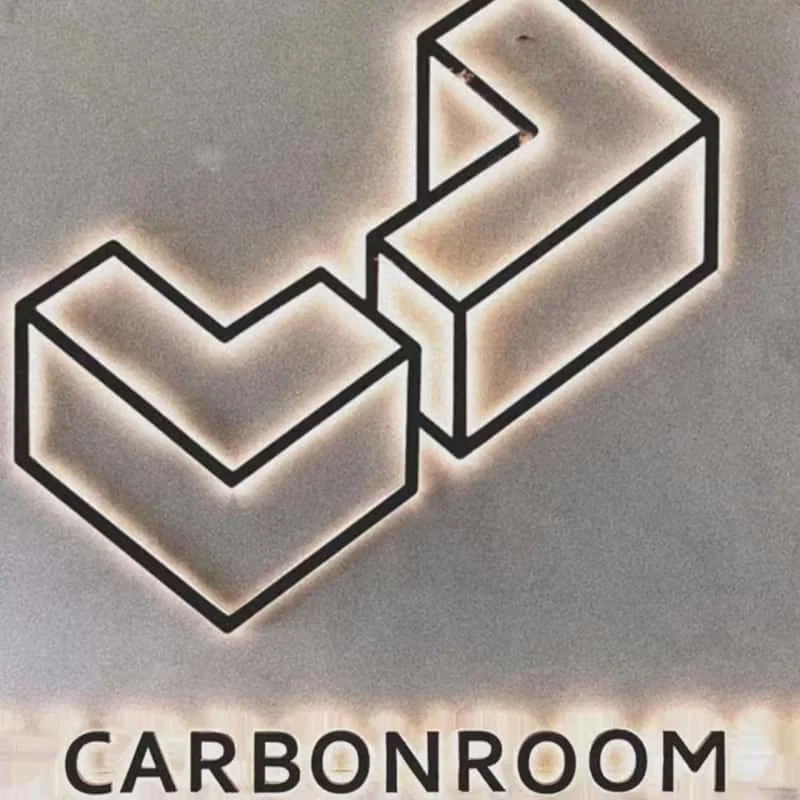 Carbonroom halo-lit logo showing controlled light spread