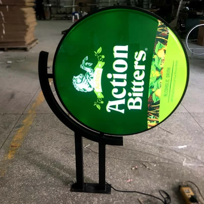 Round projecting light box on a floor stand