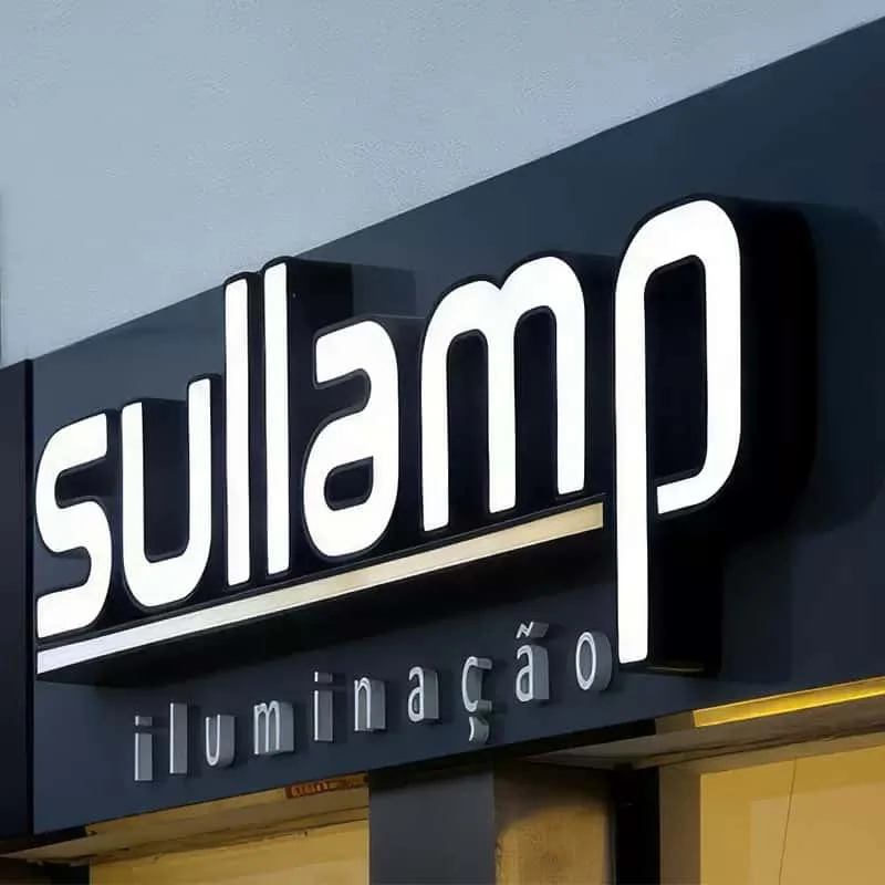 Illuminated outdoor storefront logo sign with metal housing