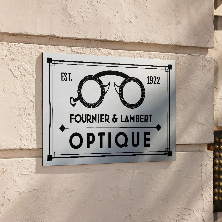 Exterior metal wall sign installed on masonry