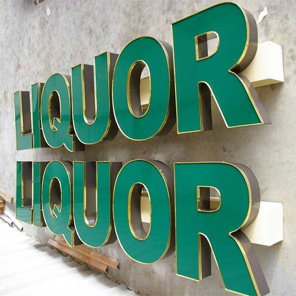 Channel letter sign assembly showing raceway mounting behind the letters