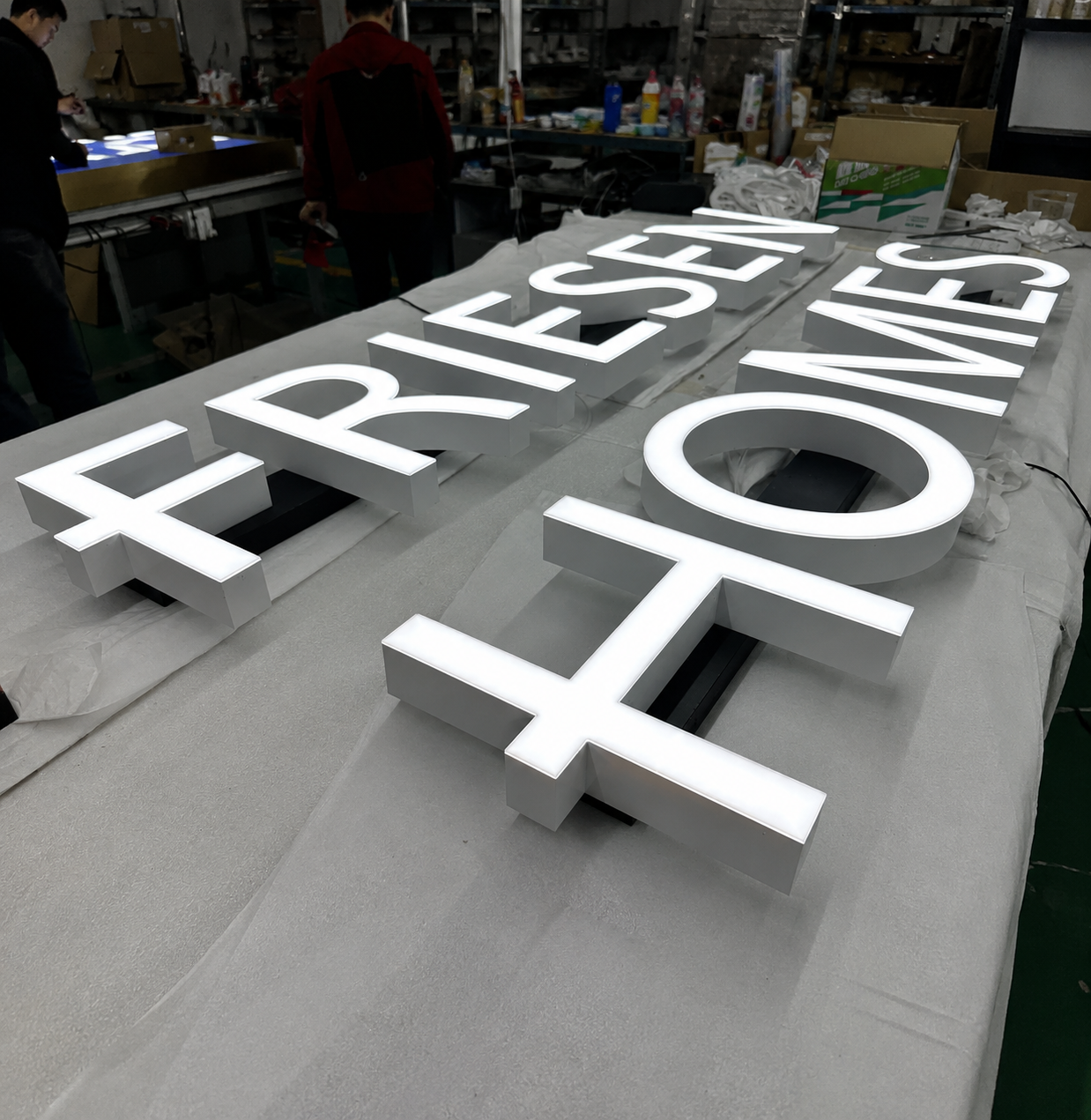 Illuminated channel letters prepared for raceway installation