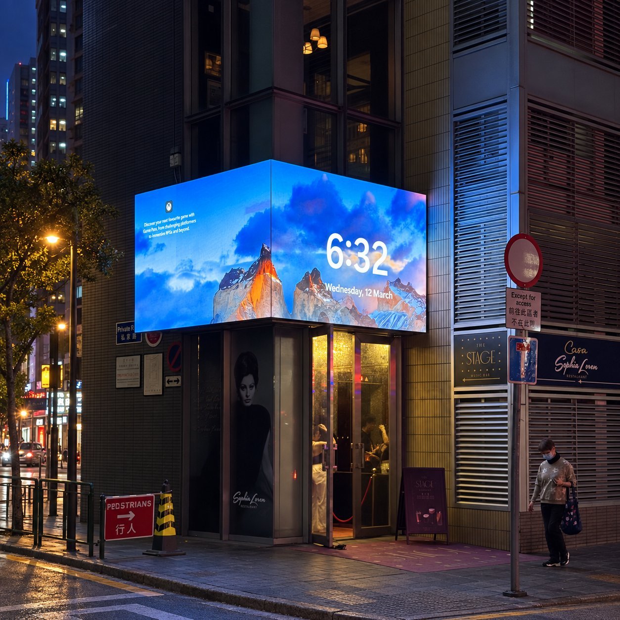 Building Corner Wrap LED Display Corner-wrap LED display integrated into a building exterior at a storefront entrance.
