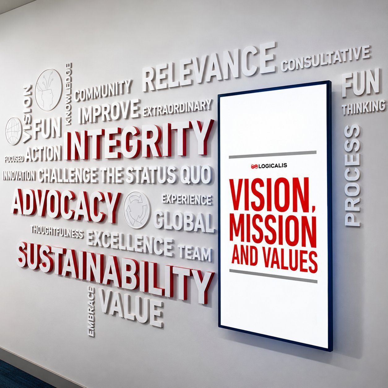 Dimensional lobby word wall with bold red accent lettering and a vision-mission framed panel.