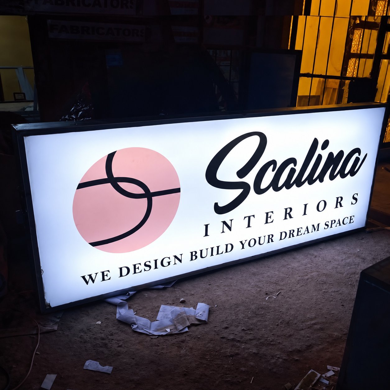 Scalina Interiors illuminated lightbox with logo and brand tagline, an example of finished acrylic factory signage.