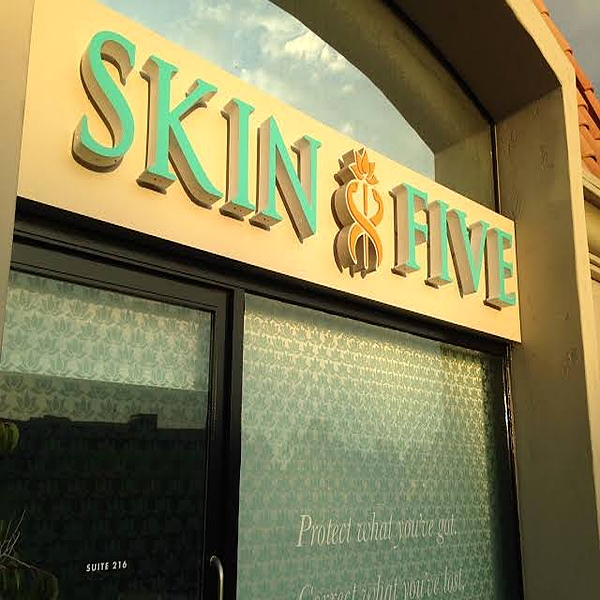 Dimensional non-illuminated storefront letters mounted on a glass storefront